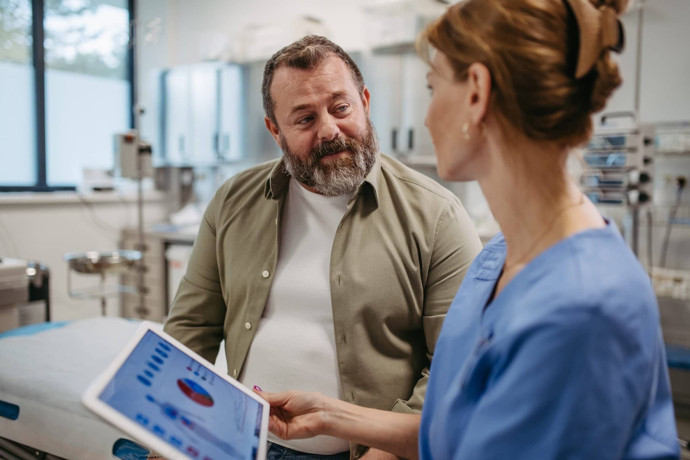 Female,Doctor,Consulting,With,Overweight,Patient,,Discussing,Test,Result,In