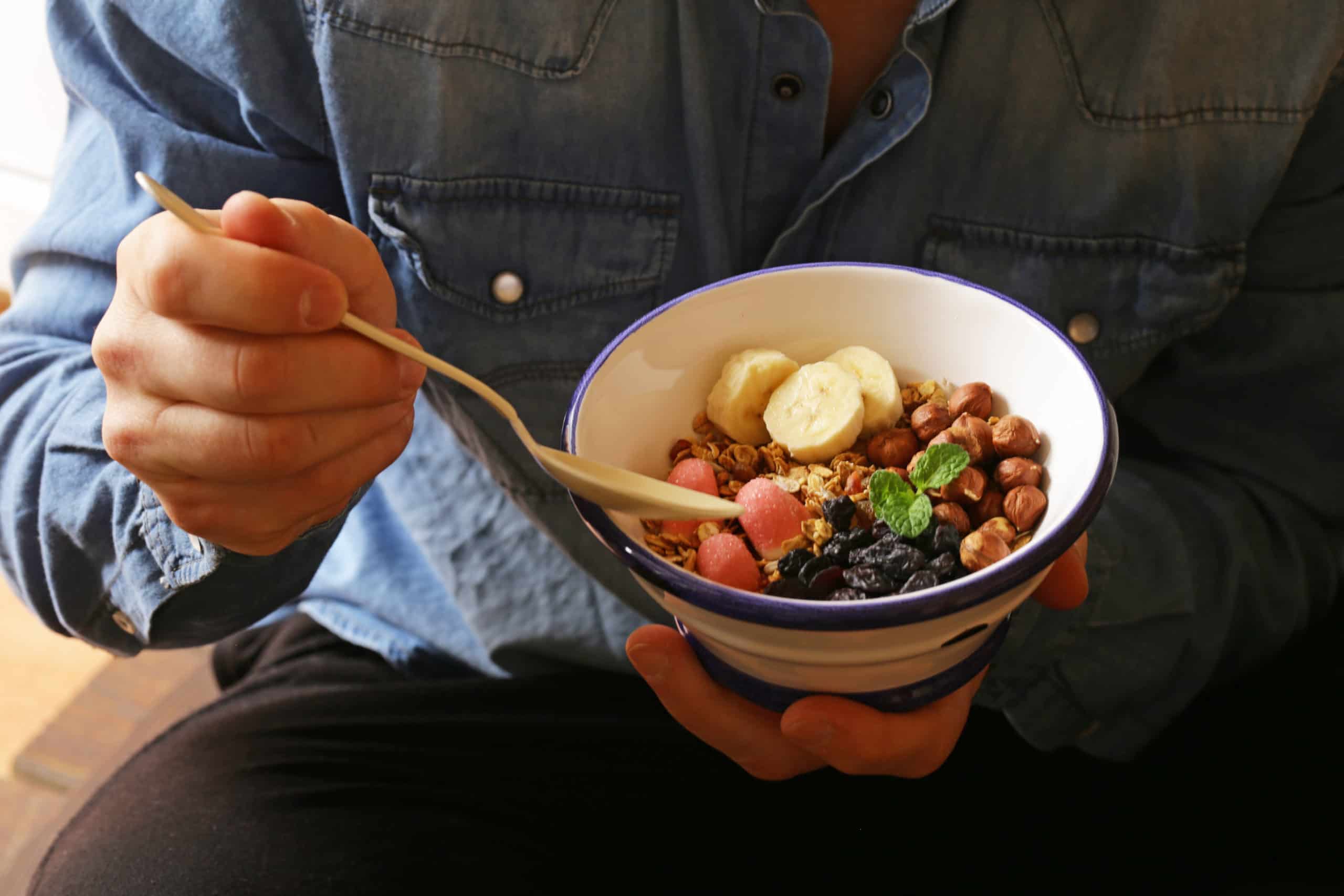 person eating healthy food for breakfast